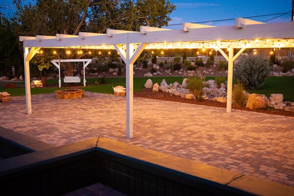 Pergola with lights over pavers picture. Turf. Outdoor Living Spaces Photo