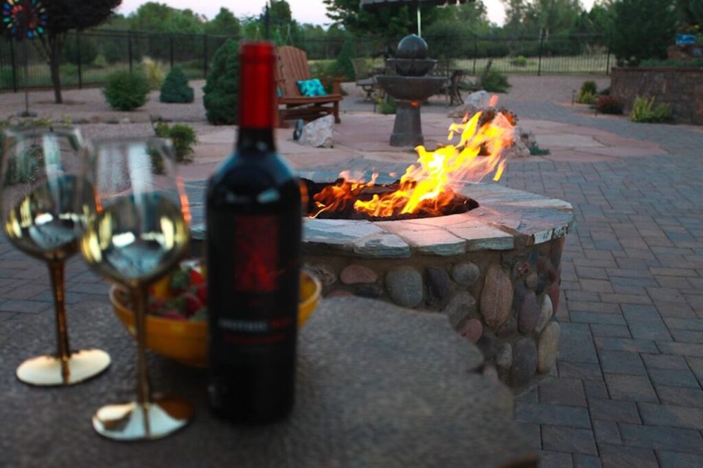 Fire pit with wine picture. Outdoor Living Spaces photo