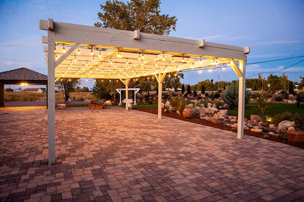 Pergola with lights over pavers picture. Outdoor Spaces Venue Photo 2
